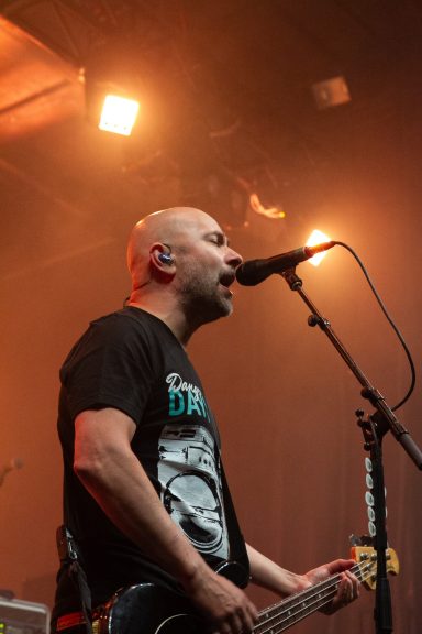 Millencolin - Red Bridge Fest 2026 Musician performing on stage, singing into a microphone with a guitar.