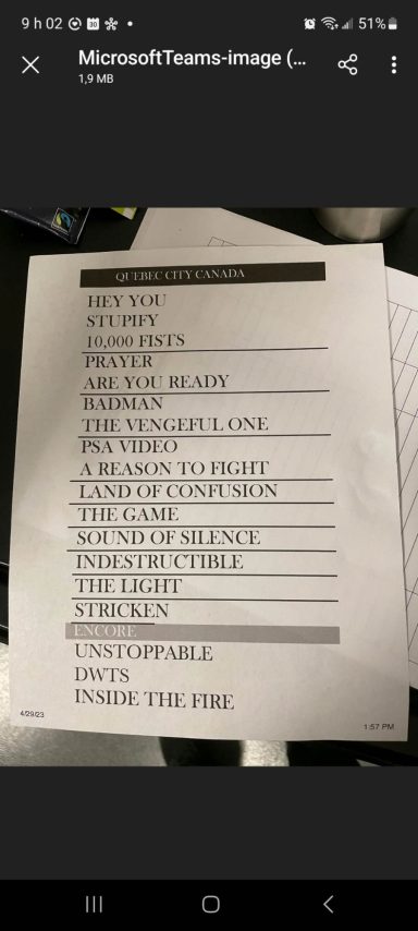 List of items including categories and quantities, handwritten on a sheet of paper.