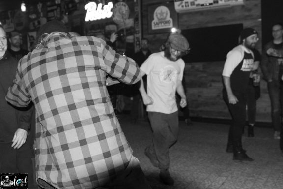 Dead Bob - La Source de la Martinière Group of people dancing in a lively, dimly lit venue.