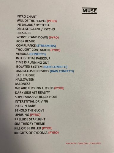 List of songs and artists on a printed document.